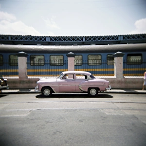 Hope Prints: Old pink American car outside railway station, Havana, Cuba, West Indies, Central America