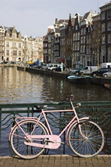 Bike Prints: Old pink bicycle by the Herengracht canal, Amsterdam, Netherlands, Europe