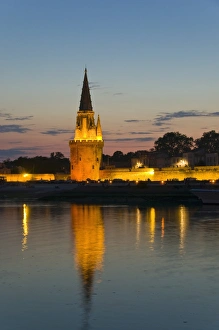 Old prison tower seen across the harbour entrance at dusk, La Rochelle Old prison tower seen across the harbour entrance at dusk, La Rochelle