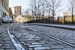 Parked Prints: Old rail tracks and cobbled street in Dumbo Historic District, Brooklyn, New York City