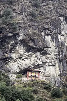 Rock Face Prints: An old religious building built into the side of a cliff in the Sagarmatha National Park UNESCO World Heritage Site