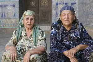 Old traditionally dressed women in the palaces of Khiva, Uzbekistan, Central Asia, Asia