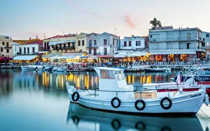 Old Venetian harbour, taverns on seaside at dusk, Rethymno (Rethymnon), Crete, Greek Islands