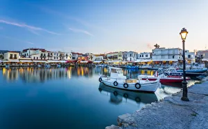 Old Venetian harbour, taverns on seaside at dusk, Rethymno (Rethymnon), Crete, Greek Islands