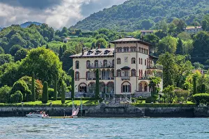 Docked Prints: Old villa on the lakeshore with lush greenery in Lenno, Lake Como, Italy in a sunny day