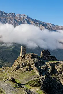 Terrain Prints: Old watchtower stands on rocky hill in Caucasus mountains with cloudy sky in North Ossetia