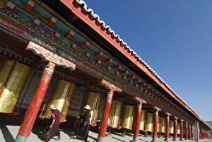 Spinning Prints: Two old women turning prayer wheels, Tagong temple, Tagong, Sichuan, China, Asia