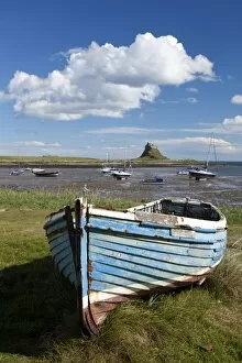 Images Dated 11th September 2010: Old wooden fishing boat on a grassy bank with Lindisfarne harbour