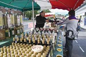 Images Dated 4th October 2008: Olive oil stall at the Italian market at Walton-on-Thames, Surrey, England