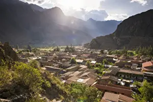 Inca Prints: Ollantaytambo Inca Ruins at sunset seen behind Ollantaytambo Town