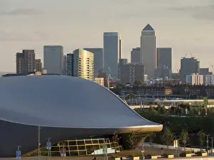 Sporting Venue Prints: Olympic Park Aquatic Centre with Docklands and Canary Wharf skyline behind, London