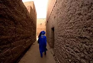 Omar walks through his home town, just south of Mahmid, Morocco, North Africa, Africa
