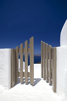 Stereotypically Greek Prints: Open gate and view at Oia, Santorini, Cyclades, Greek Islands, Greece, Europe