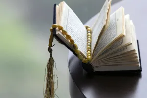 An open Holy Quran and Muslim prayer beads, Ho Chi Minh City, Vietnam, Indochina An open Holy Quran and Muslim prayer beads, Ho Chi Minh City, Vietnam, Indochina