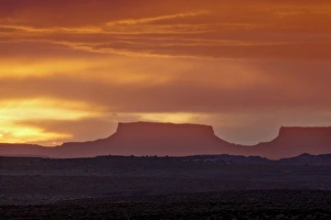 Canyon Country Prints: Orange clouds behind a butte at sunset, Canyon Country, Utah, United States of America