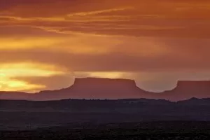 Images Dated 14th May 2010: Orange clouds behind a butte at sunset, Canyon Country, Utah, United States of America
