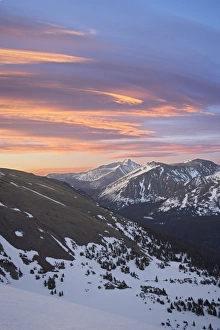 Orange clouds at dawn above Longs Peak