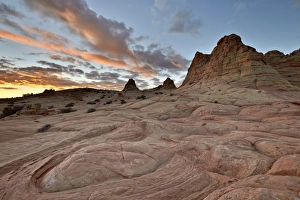 Hoodoo Prints: Orange clouds at sunrise above sandstone formations