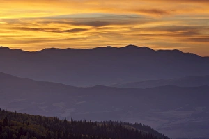 Ridges Prints: Orange clouds at sunset over layered mountains, Manti-La Sal National Forest