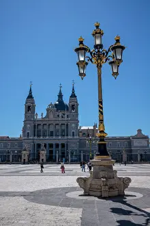 Lamp Prints: An ornate lamp in the grounds of the Palacio Real with Catedral de Santa Maria la Real de la Almudena