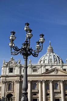 Ornate lamp and St. Peters Basilica, Piazza San Pietro, Vatican City