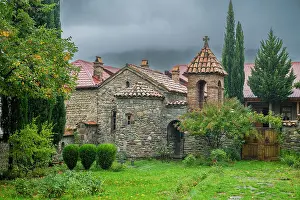 South Prints: Orthodox Ikoti Monastery shows traditional architecture in Leningor amidst greenery with clouds in the sky in South