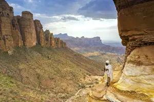 Males Prints: Orthodox priest admiring Gheralta Mountains from the entrance of Abuna Yemata Guh church
