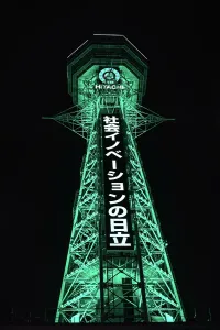 Nightlife Prints: Osaka Tsutenkaku tower in the Shinsekai district. Illuminated green night lights. Japan