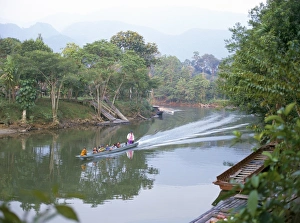 Mulu Prints: Outboard powered longboat on the Melinau River