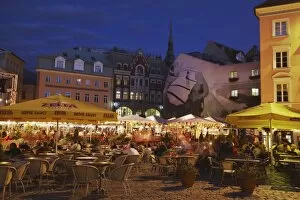 Outdoor cafes in Dome Cathedral Square at dusk, Riga, Latvia, Baltic States, Europe