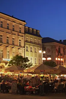 Squares Prints: Outdoor cafes in Main Market Square (Rynek Glowny) at dusk, Krakow, Poland, Europe