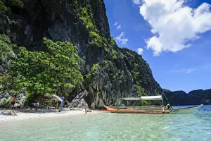 Filipino Culture Prints: Outrigger boat in the crystal clear water in the Bacuit archipelago
