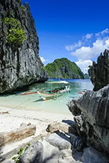 Filipino Culture Prints: Outrigger boat on a little white beach and crystal clear water in the Bacuit archipelago