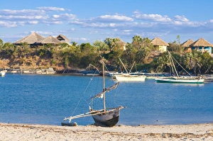 Bungalow Prints: Outrigger boat lying on bank of sand