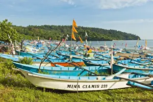 Outrigger fishing boats on west beach of the isthmus at this major beach resort on the south coast, Pangandaran, Java, Indonesia, Southeast Asia, Asia