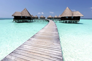 Over-water villas, crystal clear sea and blue sky, Coco Palm, Dhuni Kolhu, Baa Atoll