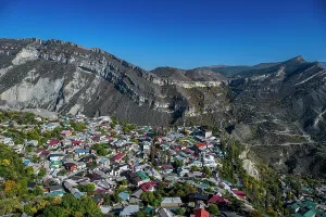Peaks Prints: Overlook of mountains and village in Dagestan with clear sky in bright daylight