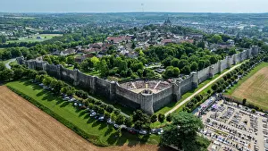 Homes Prints: Overview of medieval town of Provins in France with historic walls and green areas around the buildings and fields