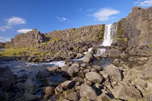 Rock Cliffs Prints: Oxara River tumbles down the Almannagja cliff face at Oxarafoss, Thingvellir National Park