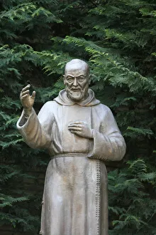 Human Representation Prints: Padre Pio sculpture in a Roman park, Rome, Lazio, Italy, Europe