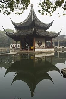 A pagoda reflected in the water at West Garden Buddhist Temple, Suzhou