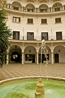Images Dated 12th April 2010: Painted decorated Arch Gallery and fountain of the Plaza del Cabildo, Seville