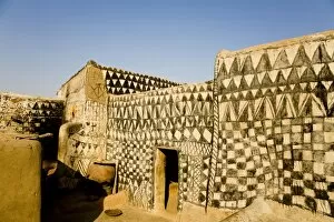 Painted mud house in Tangassogo Village, near the border of Ghana, Burkina Faso