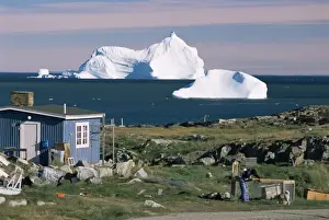 Godthab Prints: Painted wooden fishermans house in front of icebergs in Disko Bay