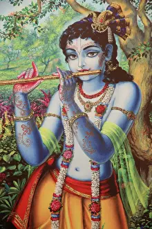Typically Indian Prints: Painting depicting Hindu god Krishna playing a flute outdoors, Vrindavan, Uttar Pradesh