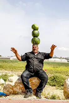 Mature Man Prints: Palestinian selling watermelons at Al-Jalameh checkpoint on Israel-Palestine border
