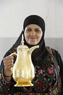 Palestinian volunteer offering coffee at the Physicians for Human Rights'