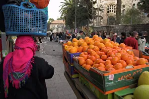 Stall Prints: Palestinian woman in colourful scarf and carrying bag