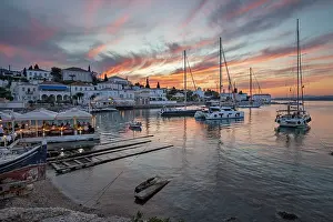 Yachts Prints: Palio Limani old harbour in Spetses town at sunset with yachts and restaurants