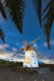 Windmills Prints: Palm trees framing a lone windmill under Milky Way, El Cotillo, La Oliva, Fuerteventura